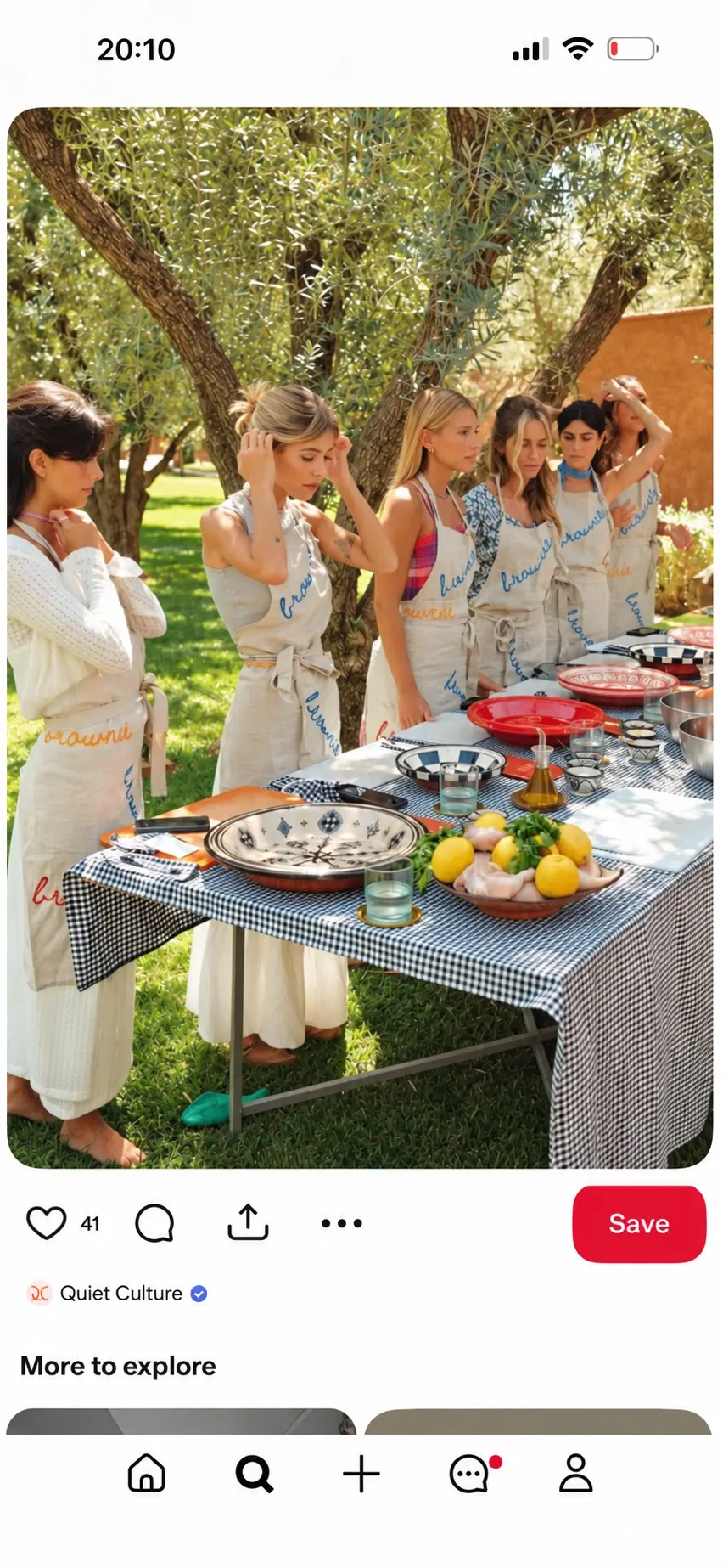 A group gathered around an outdoor cooking table