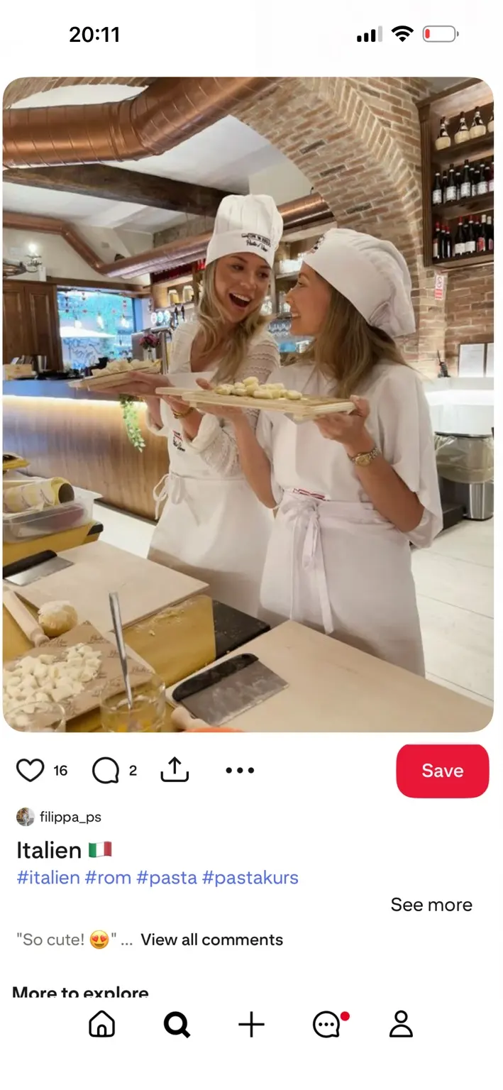 Two participants smiling during a cooking class