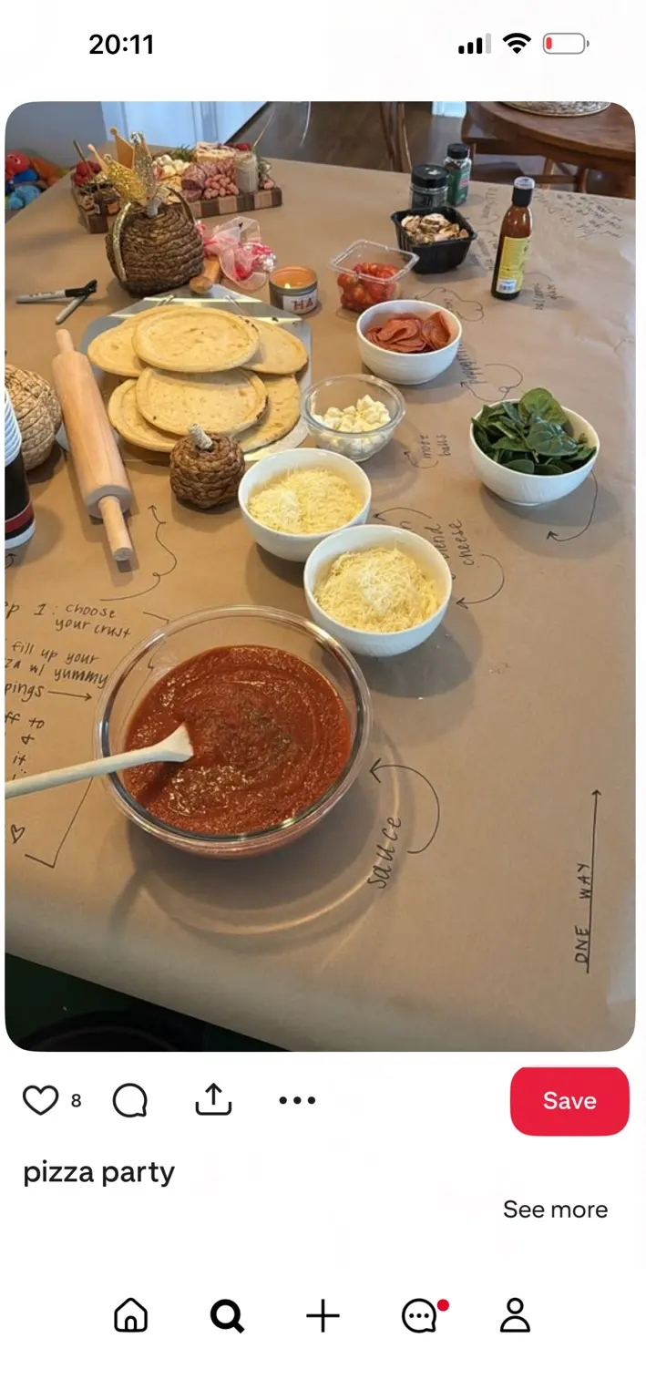 Pizza bases, tomato sauce and toppings ready for a shared cooking evening