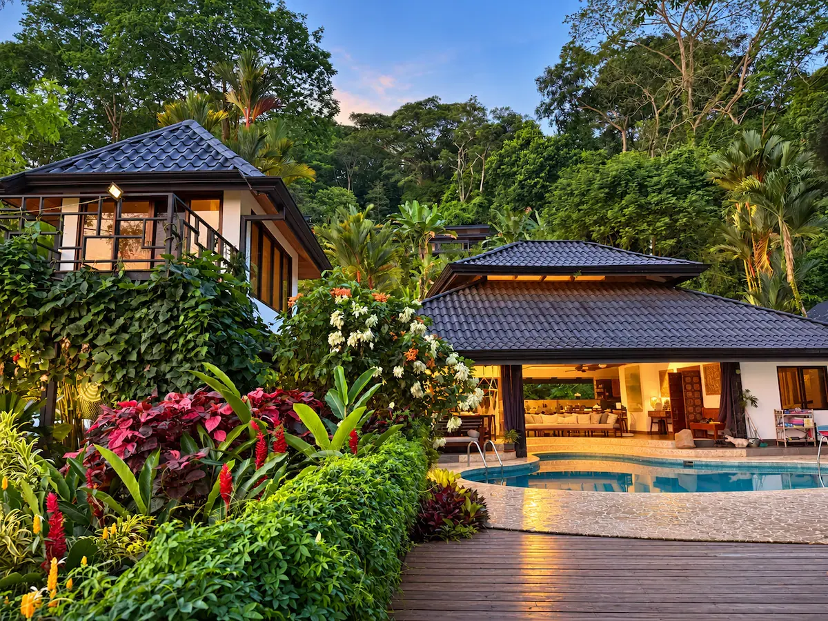 Tropical flowers and lush gardens beside the retreat villas and pool